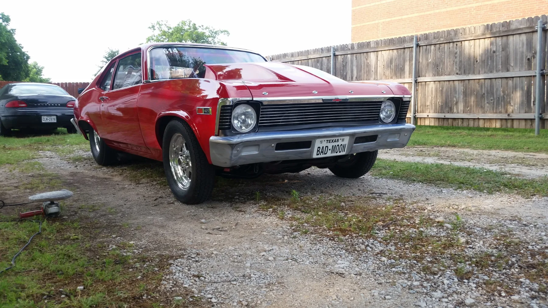 Finished red classic car outside the Red Barn shop