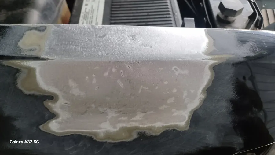 Black panel body filler closeup