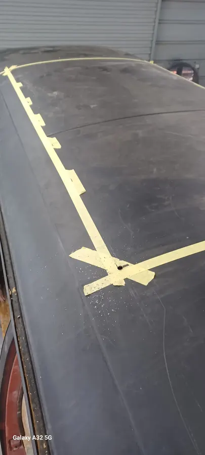 Black roof masked with sanding guide