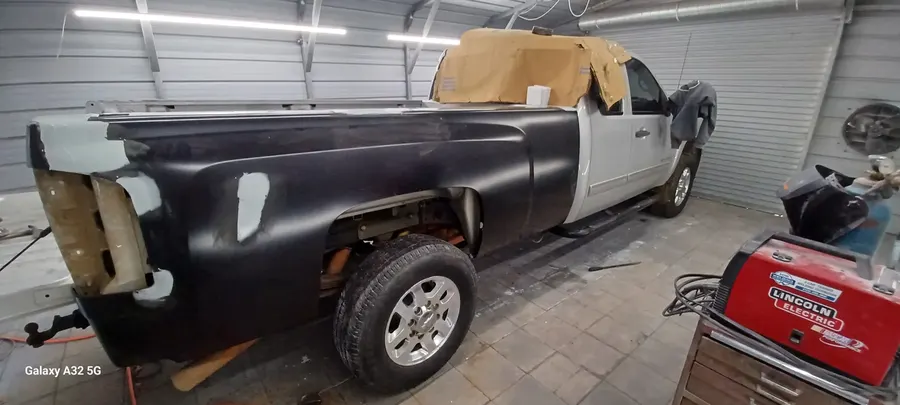 Black and white truck bedside primer stage