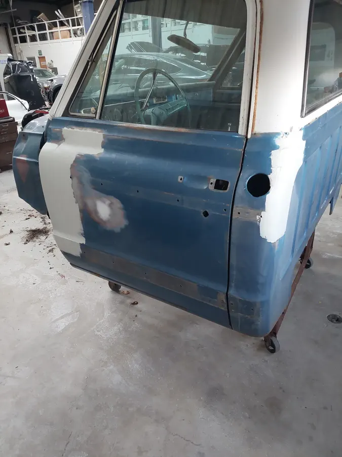Blue truck door body filler stage