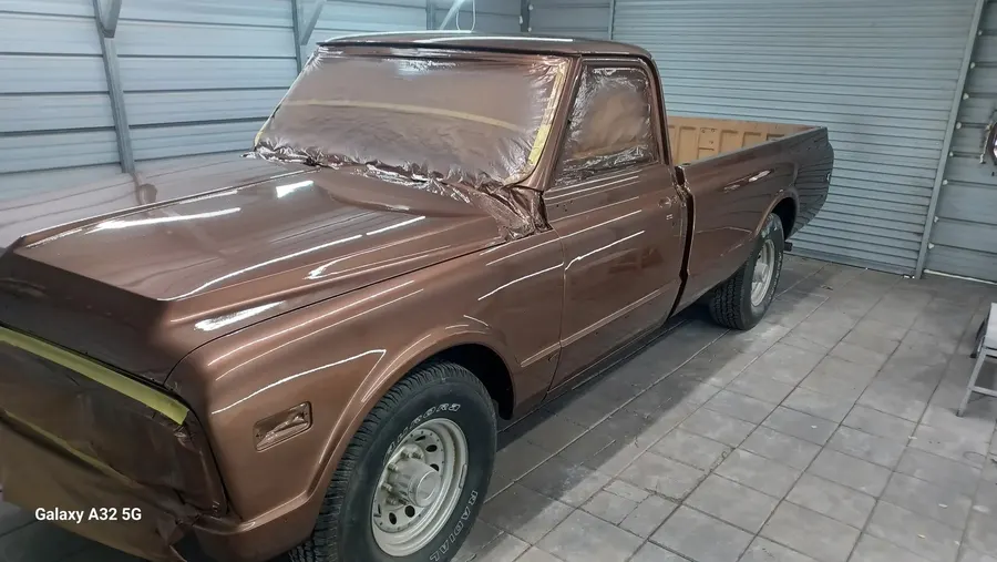Brown classic pickup inside the shop