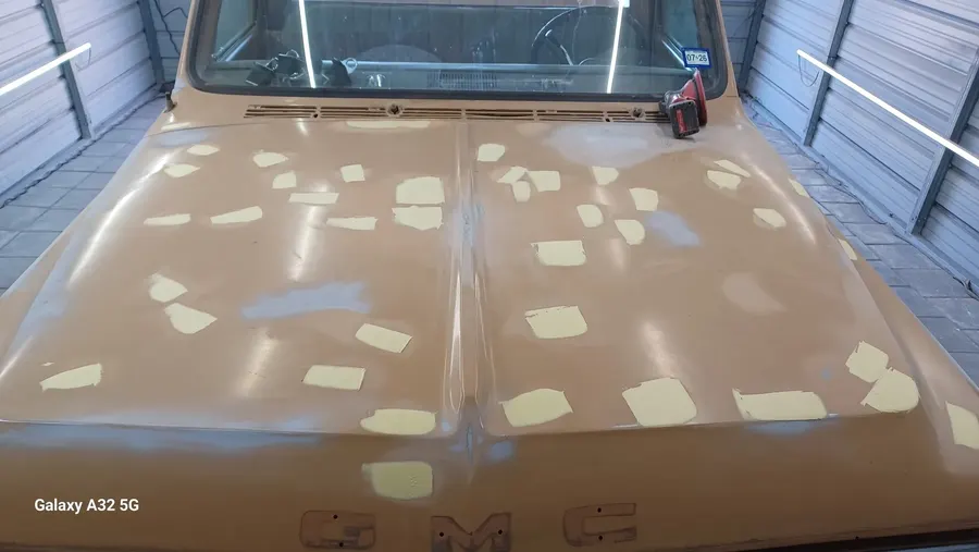 Classic pickup hood with body filler spots