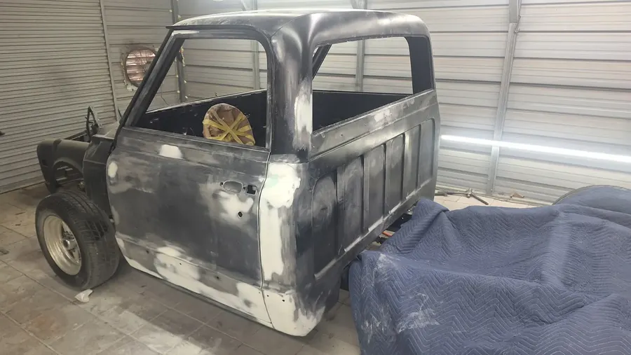 Classic truck cab in primer during metal work