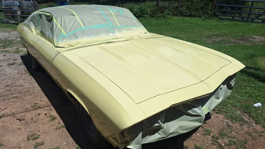 Cream classic car masked for paint