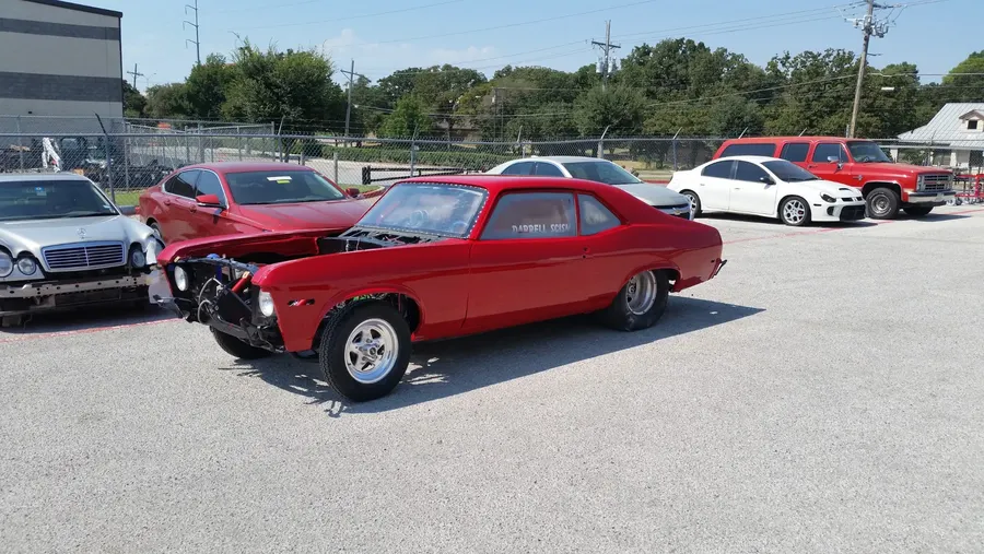 Red classic car at car show side view