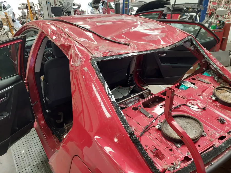 Red sedan collision teardown stage