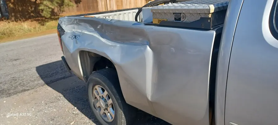 Silver truck bedside dent repair