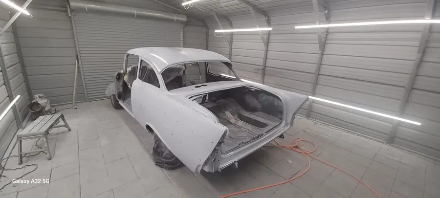 Tri-five Chevy white primer in booth