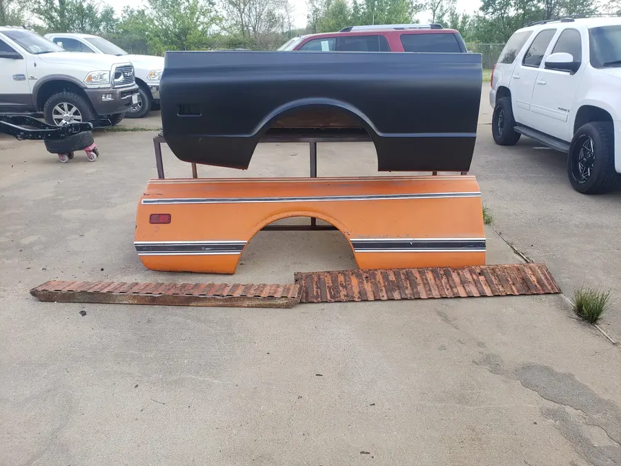 Truck paint panels staged outdoors