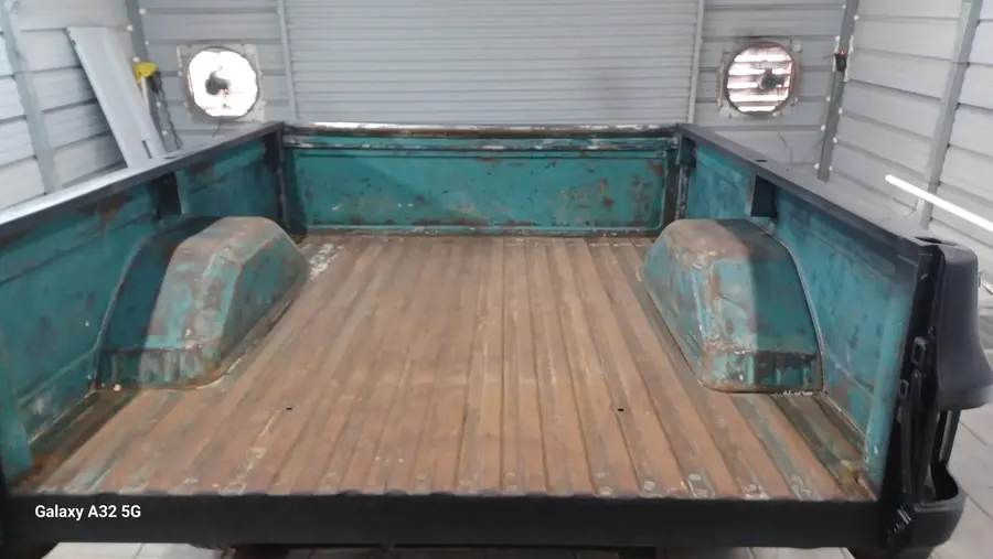 Turquoise classic truck bed with wood floor