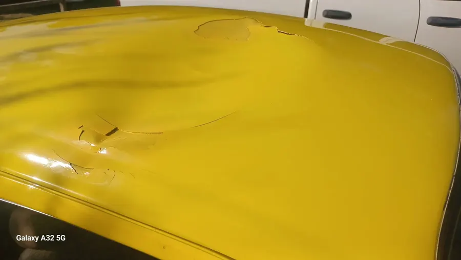 Yellow VW Beetle hood paint detail