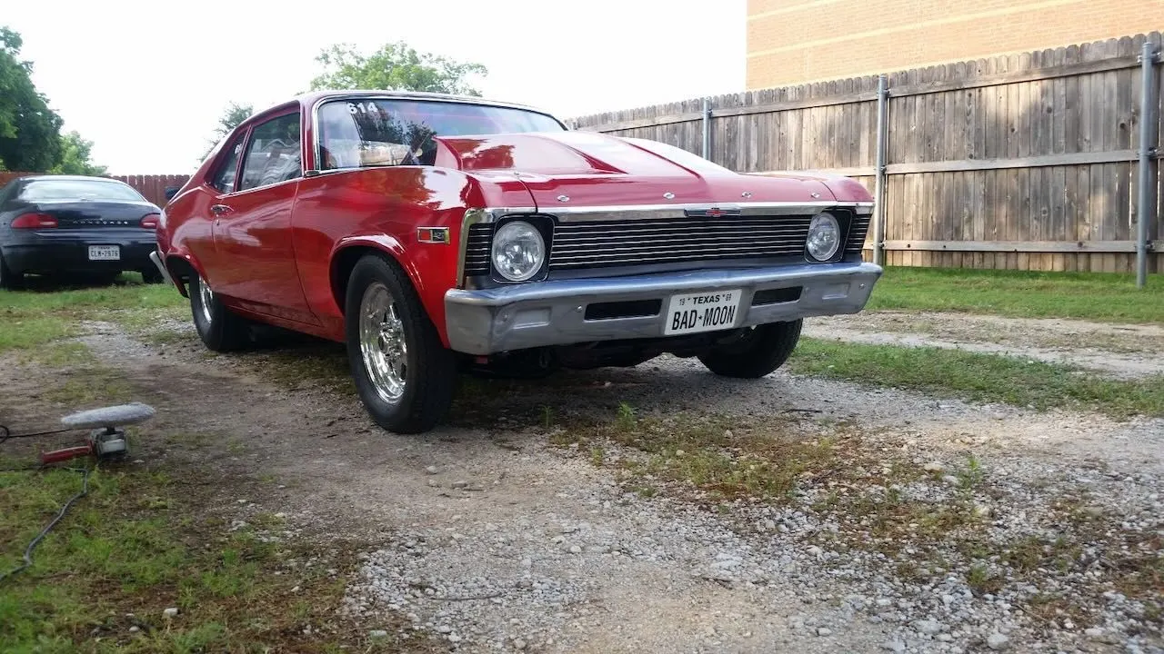 Red classic car finished by Red Barn